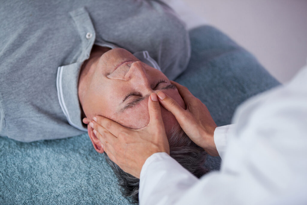 Older-man-receiving-cranial-osteopathy-treatment