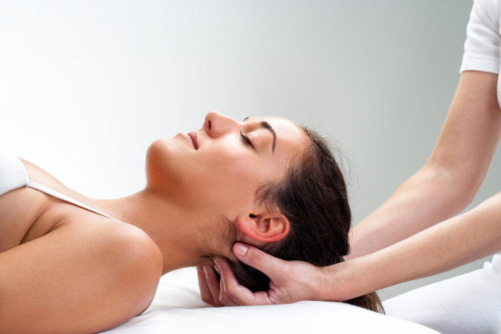 Woman-receiving-cranial-osteopathy-treatment Male osteopath near me use Cranial Osteopathy in top rehab